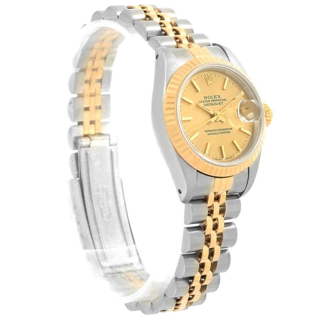 The Rolex Datejust 69173 Women's Stainless Steel Champagne Dial 69173 Women's Stainless Steel Champagne Dial watch is shown from a right-side angle, highlighting its gold dial, fluted bezel, and two-tone bracelet.