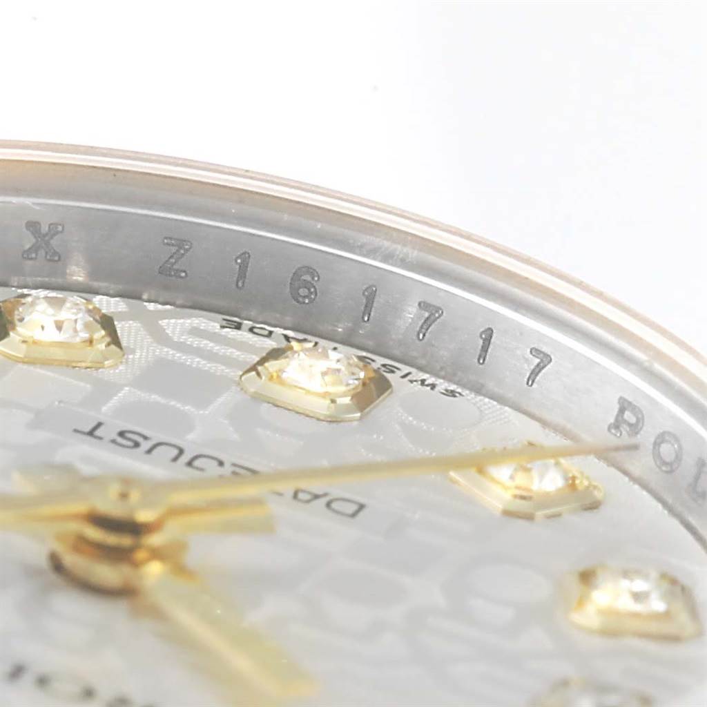 The image shows a close-up of the dial and bezel of a Rolex Datejust 179173 Women's Steel and Gold (two tone) Silver Dial 179173 Women's Steel and Gold (two tone) Silver Dial watch, highlighting the serial number and some diamond hour markers.
