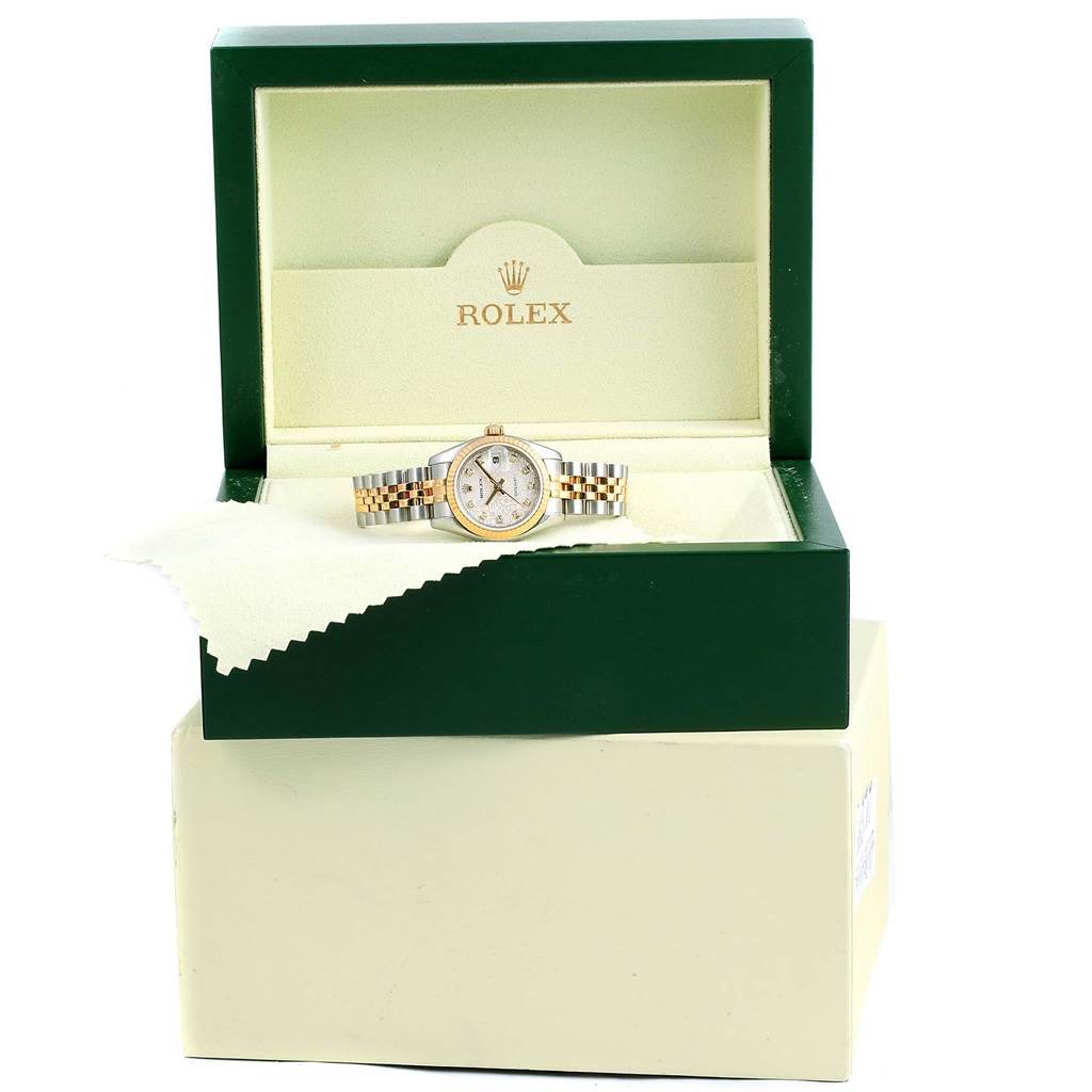 The image shows a Rolex Datejust 179173 Women's Steel and Gold (two tone) Silver Dial 179173 Women's Steel and Gold (two tone) Silver Dial watch displayed inside an open green box.
