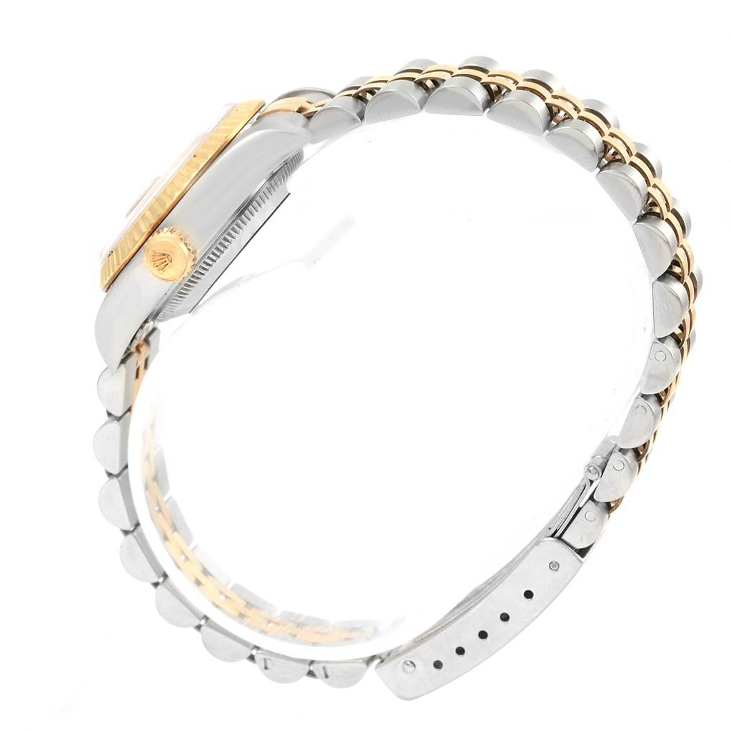 The image shows a side view of a Rolex Datejust 69173 Women's Stainless Steel Beige Dial 69173 Women's Stainless Steel Beige Dial watch, highlighting its case, crown, and two-tone bracelet.