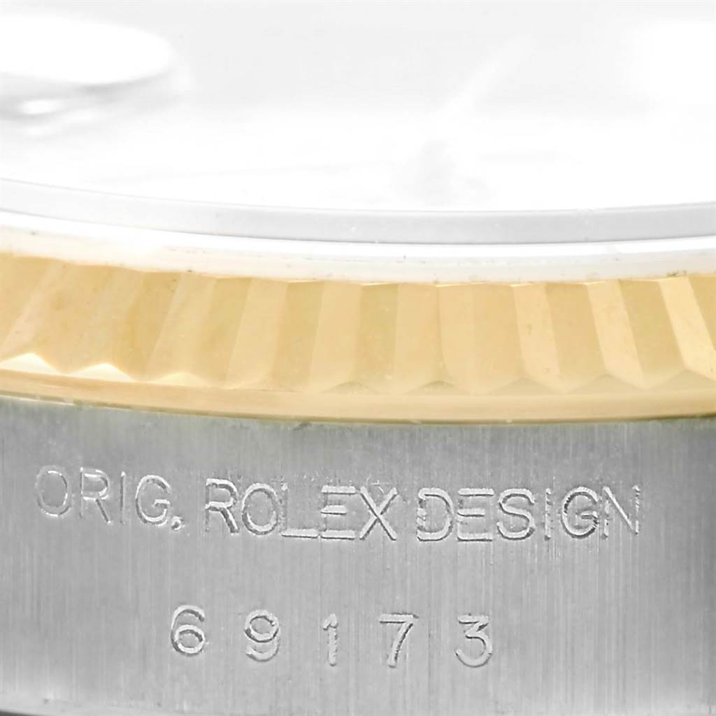 The image shows a close-up of the case side of a Rolex Datejust 69173 Women's Stainless Steel Beige Dial 69173 Women's Stainless Steel Beige Dial watch, highlighting the engraved model number "69173" and design details.