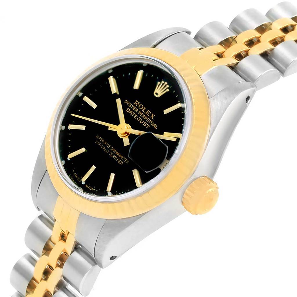 This image shows a Rolex Datejust 69173 Women's Stainless Steel Black Dial 69173 Women's Stainless Steel Black Dial watch angled from above, highlighting the black dial, fluted bezel, and two-tone bracelet.