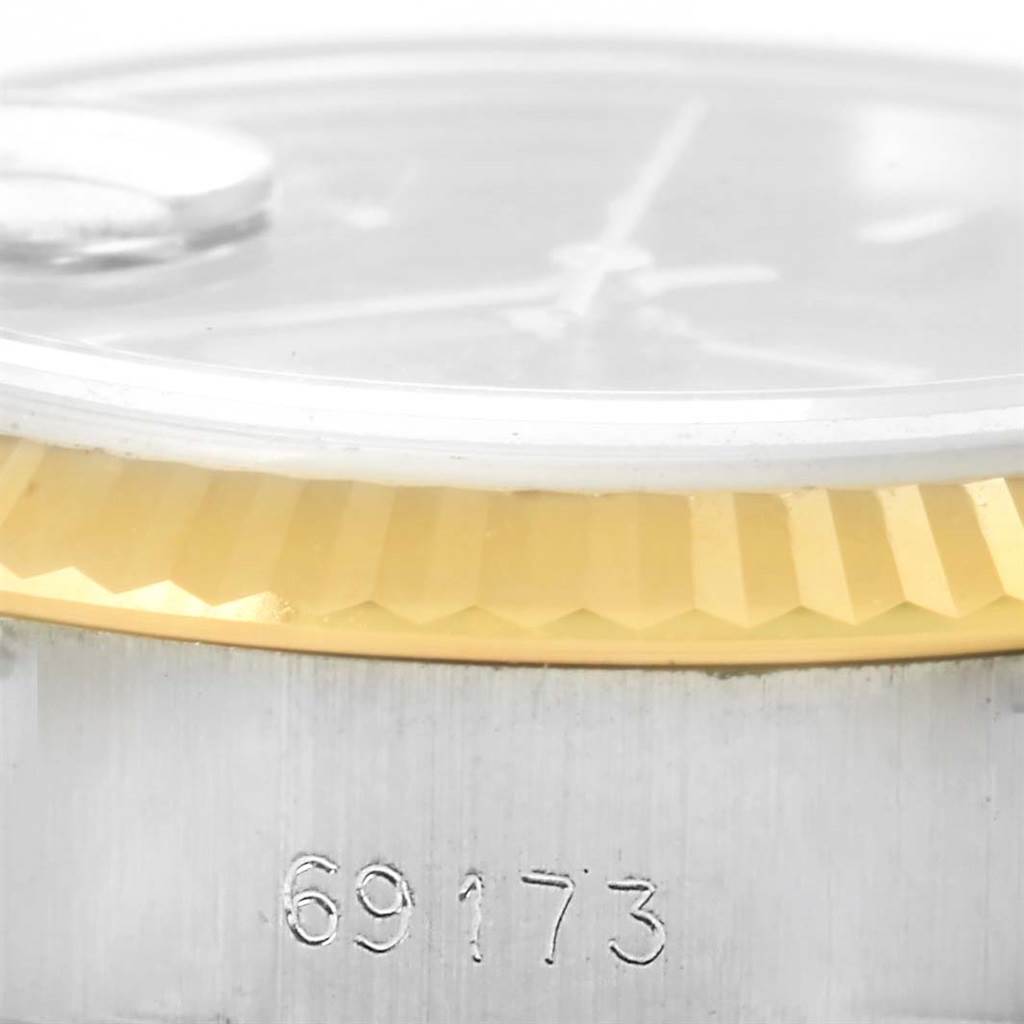 This image shows a close-up of the model number and the fluted bezel of a Rolex Datejust 69173 Women's Stainless Steel Black Dial 69173 Women's Stainless Steel Black Dial watch.