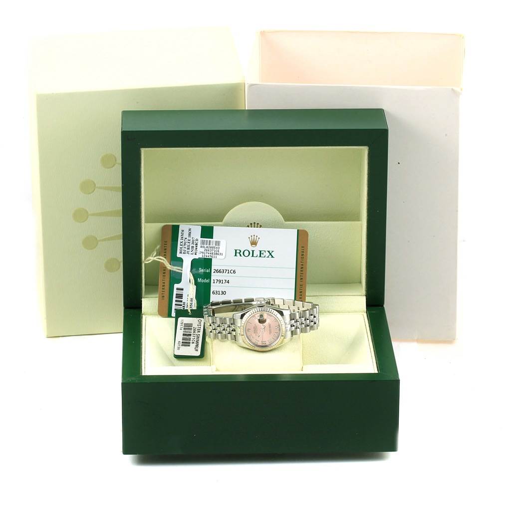The image shows a Rolex Datejust 179174 Women's Stainless Steel Pink Dial 179174 Women's Stainless Steel Pink Dial watch in a box, displayed from the front, with tags and certificates.