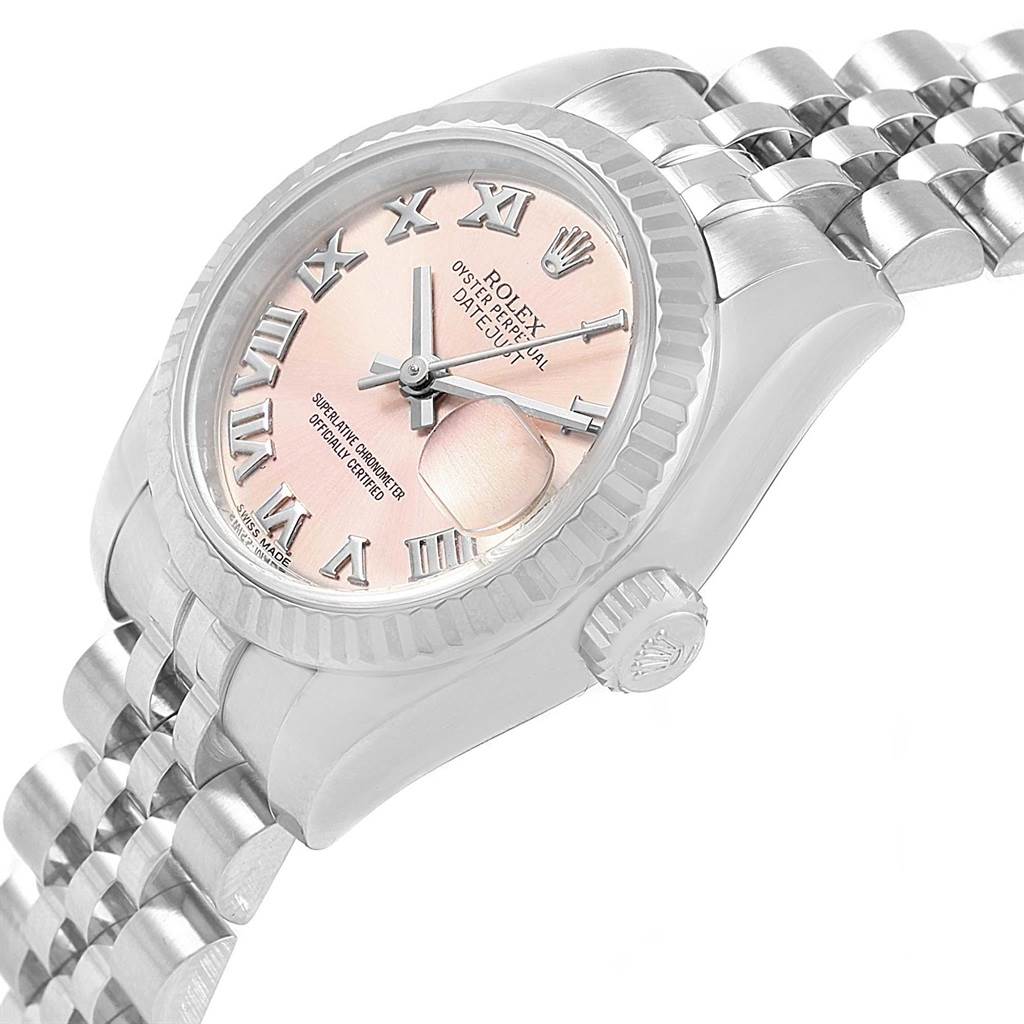 The image shows a Rolex Datejust 179174 Women's Stainless Steel Pink Dial 179174 Women's Stainless Steel Pink Dial model watch at an oblique angle, highlighting the face, crown, and part of the bracelet.