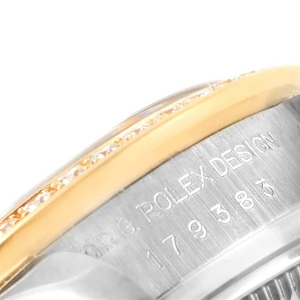 The image shows a close-up of the side of a Rolex Datejust 179383 Women's Steel and Gold (two tone) Black Dial 179383 Women's Steel and Gold (two tone) Black Dial watch, focusing on its bezel and engraved case side.