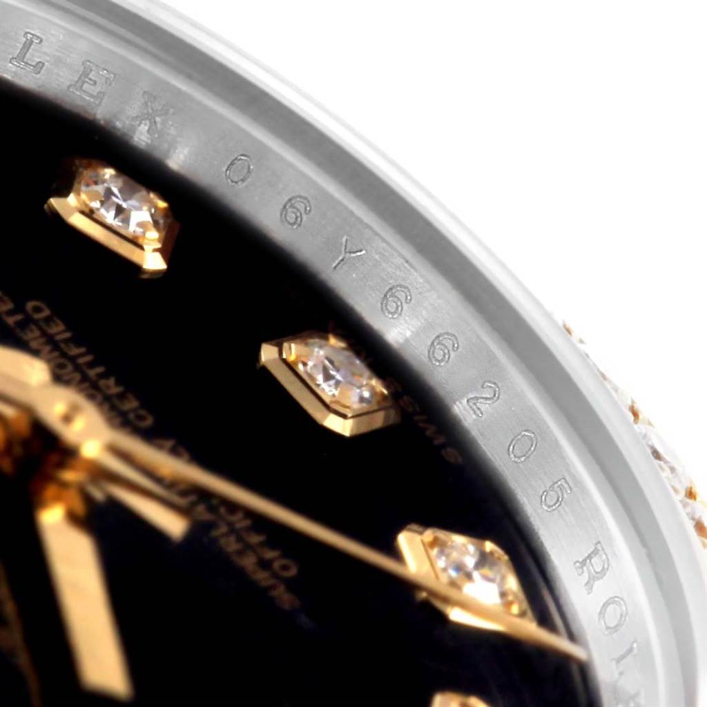 This close-up shows the dial, markers with diamonds, and part of the rehaut with the serial number of the Rolex Datejust 179383 Women's Steel and Gold (two tone) Black Dial 179383 Women's Steel and Gold (two tone) Black Dial watch.