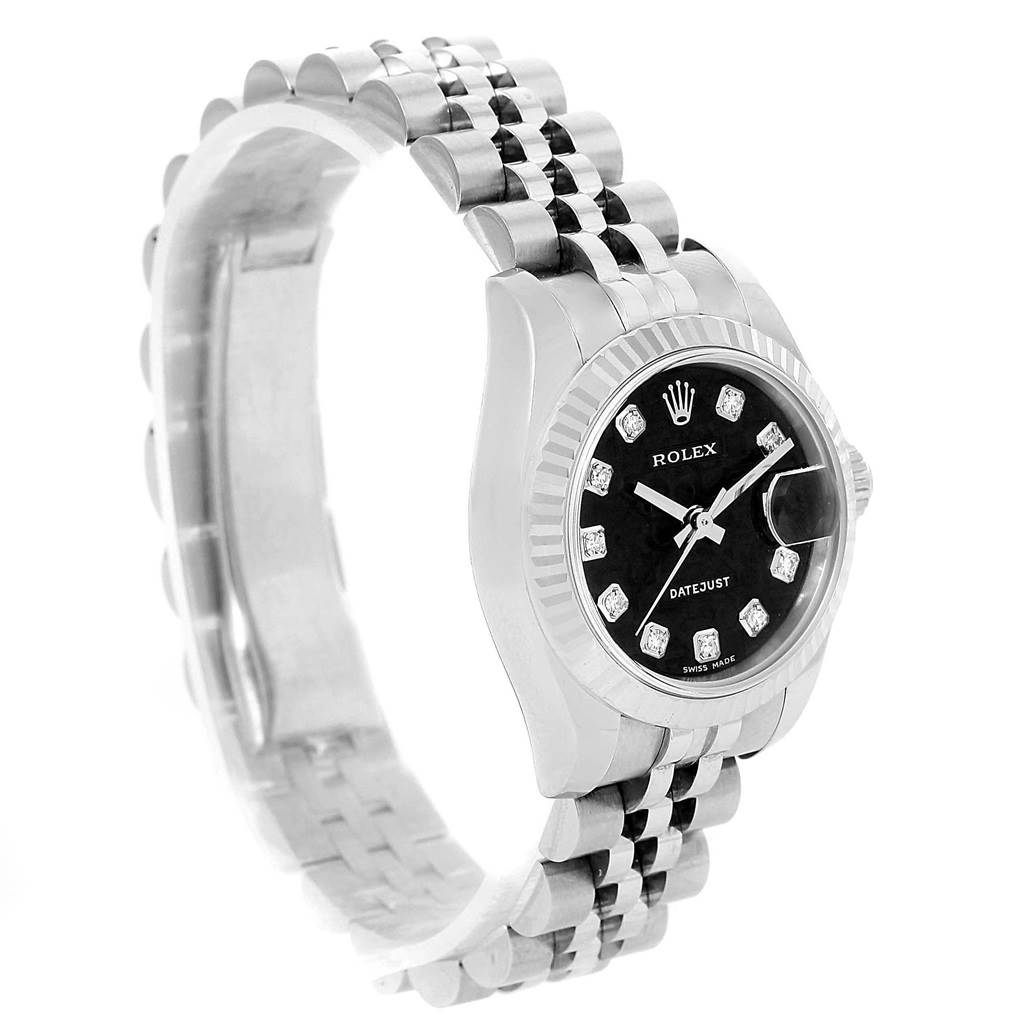 The image shows a Rolex Datejust 179174 Women's Stainless Steel Black Dial 179174 Women's Stainless Steel Black Dial watch from an angled side view, highlighting its face, bezel, and part of the band.