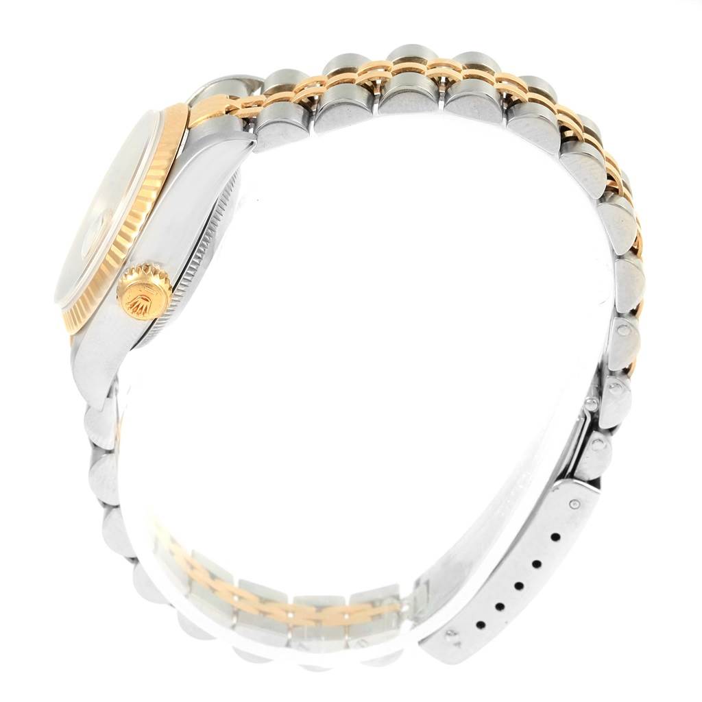 This side view of the Rolex Datejust 69173 Women's Stainless Steel Champagne Dial 69173 Women's Stainless Steel Champagne Dial watch highlights the bracelet, crown, and bezel.