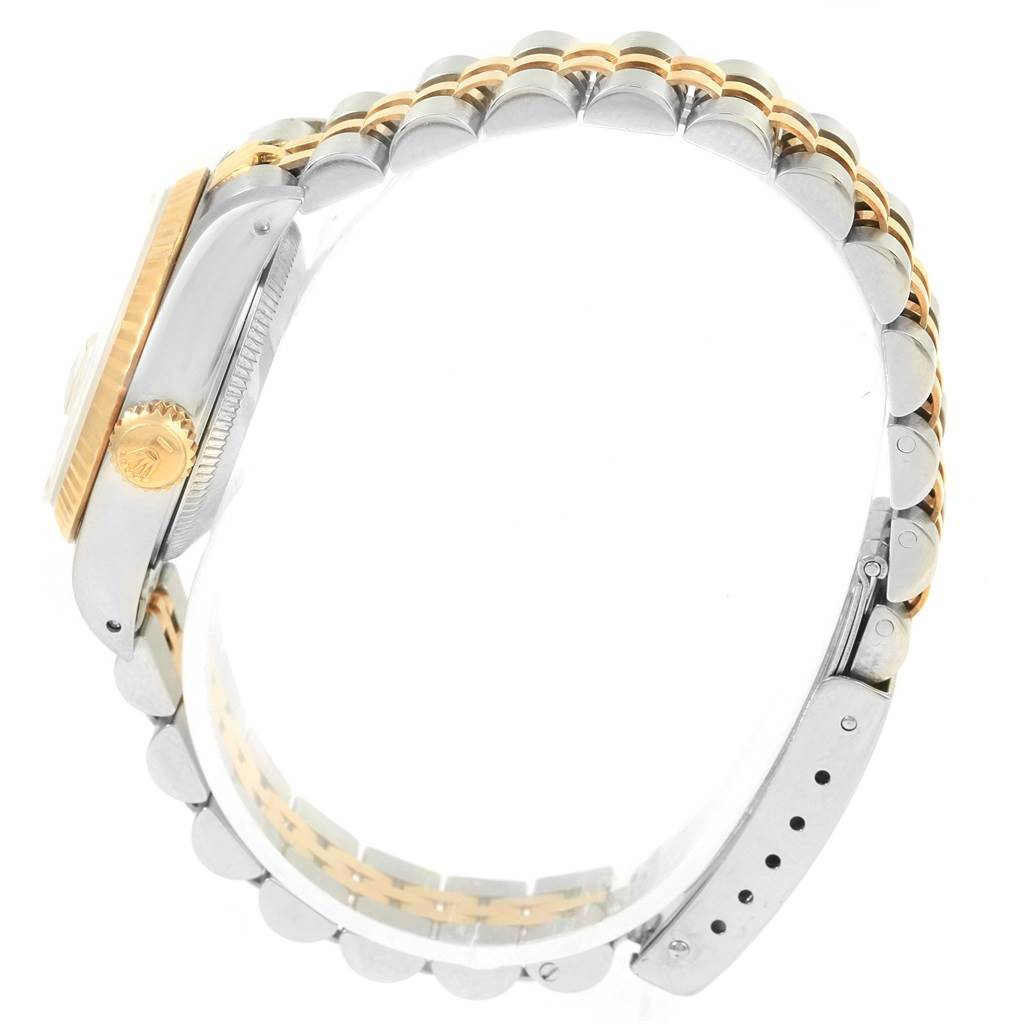 The image shows the side view of a Rolex Datejust 69173 Women's Stainless Steel Champagne Dial 69173 Women's Stainless Steel Champagne Dial watch, highlighting the two-tone bracelet and watch crown.