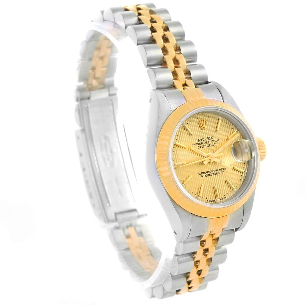 The image shows a side angle view of a Rolex Datejust 69173 Women's Stainless Steel Champagne Dial 69173 Women's Stainless Steel Champagne Dial watch, highlighting its two-tone bracelet and gold dial.