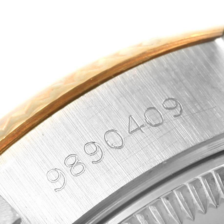 The image shows a close-up of the engraved serial number on the side of the case of a Rolex Datejust 69173 Women's Stainless Steel Champagne Dial 69173 Women's Stainless Steel Champagne Dial watch.