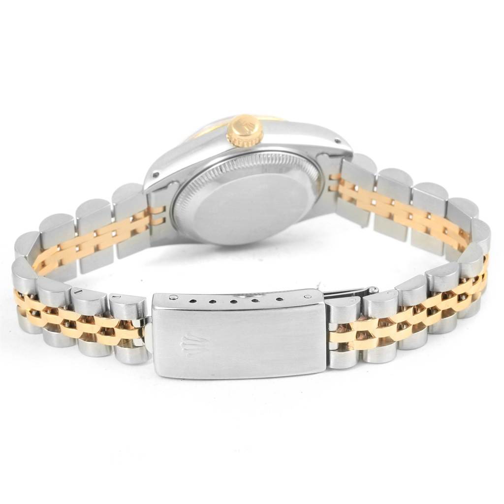 The Rolex Datejust 69173 Women's Stainless Steel Black Dial 69173 Women's Stainless Steel Black Dial watch is shown from the back, highlighting the case back and the two-tone bracelet with a clasp.