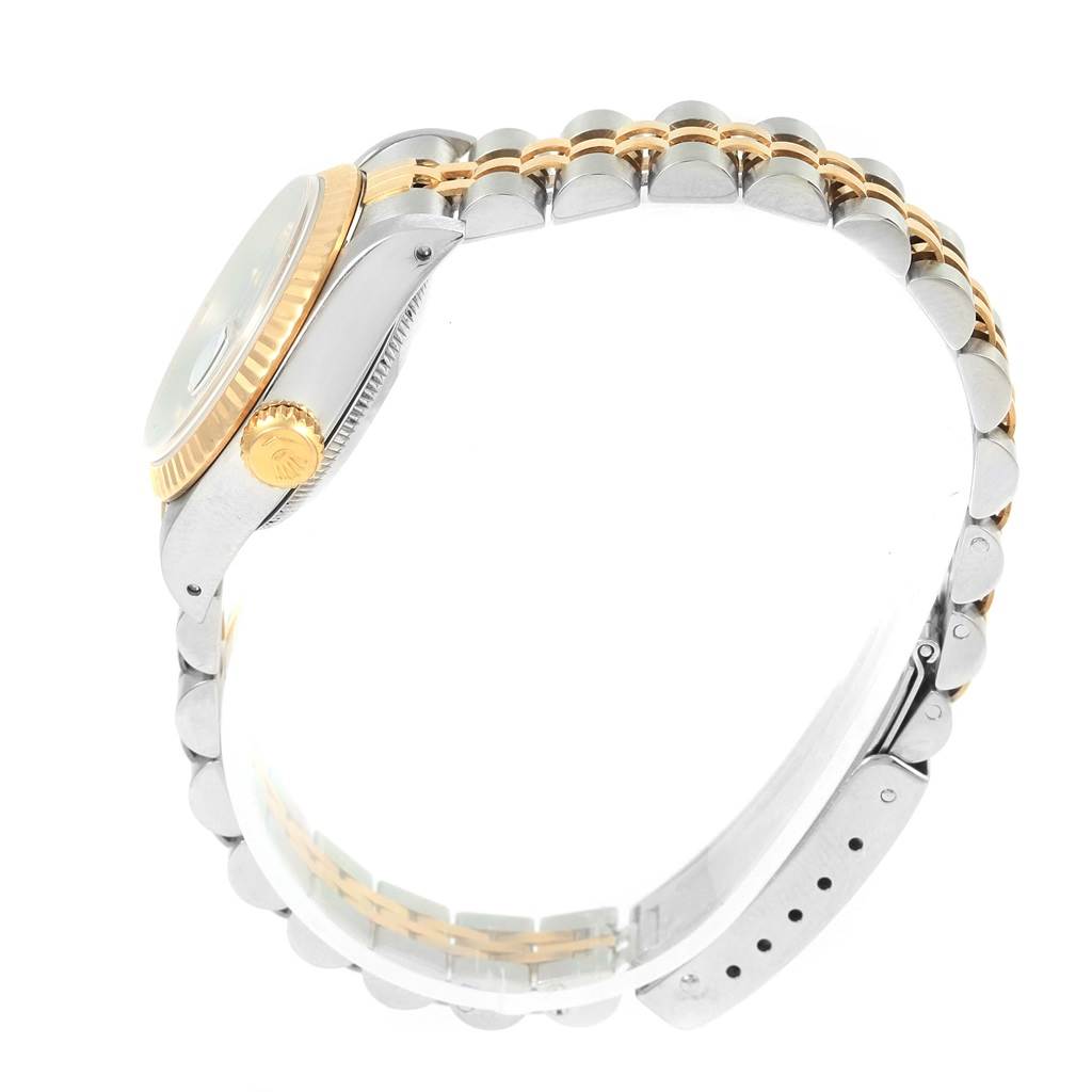 The image shows a side profile of the Rolex Datejust 69173 Women's Stainless Steel Blue Dial 69173 Women's Stainless Steel Blue Dial watch, highlighting its case, crown, and two-tone bracelet.