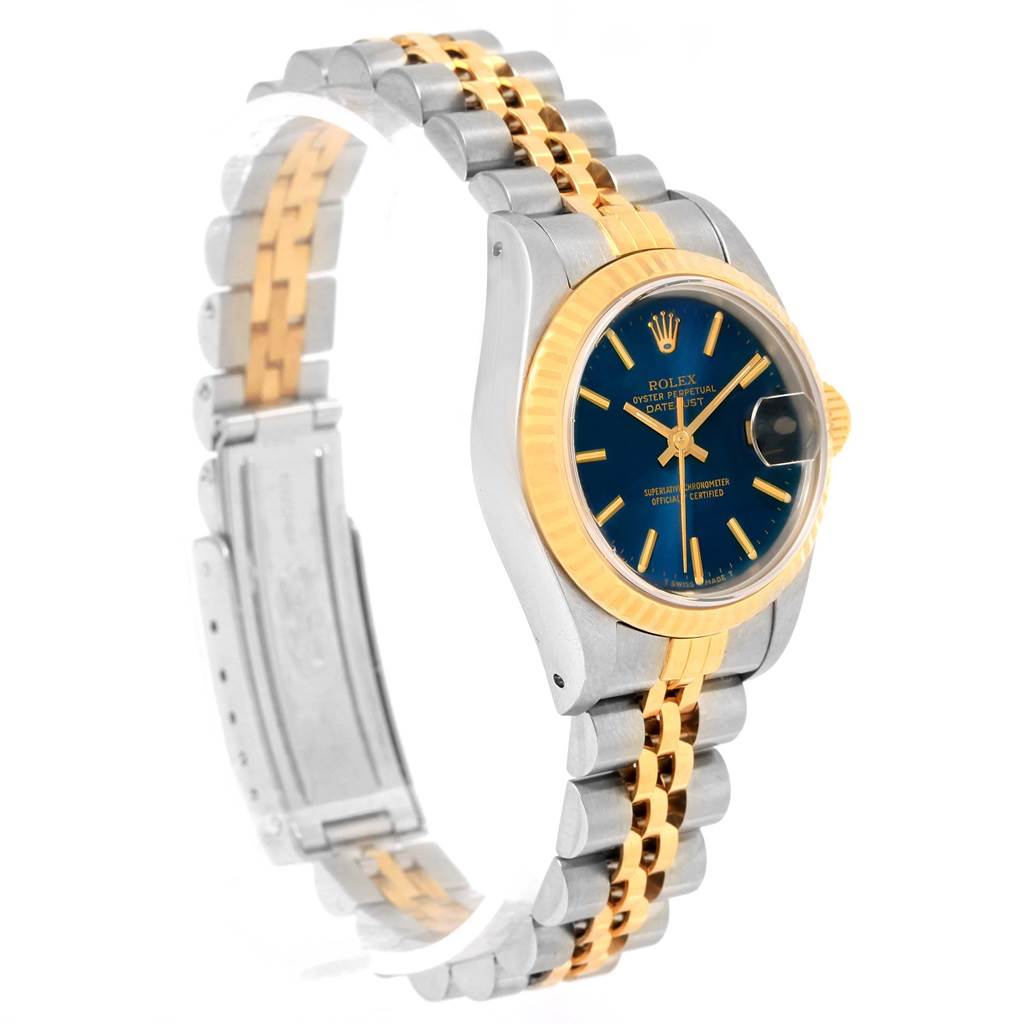 The image shows a side and partial front view of a Rolex Datejust 69173 Women's Stainless Steel Blue Dial 69173 Women's Stainless Steel Blue Dial watch featuring a two-tone metal bracelet.