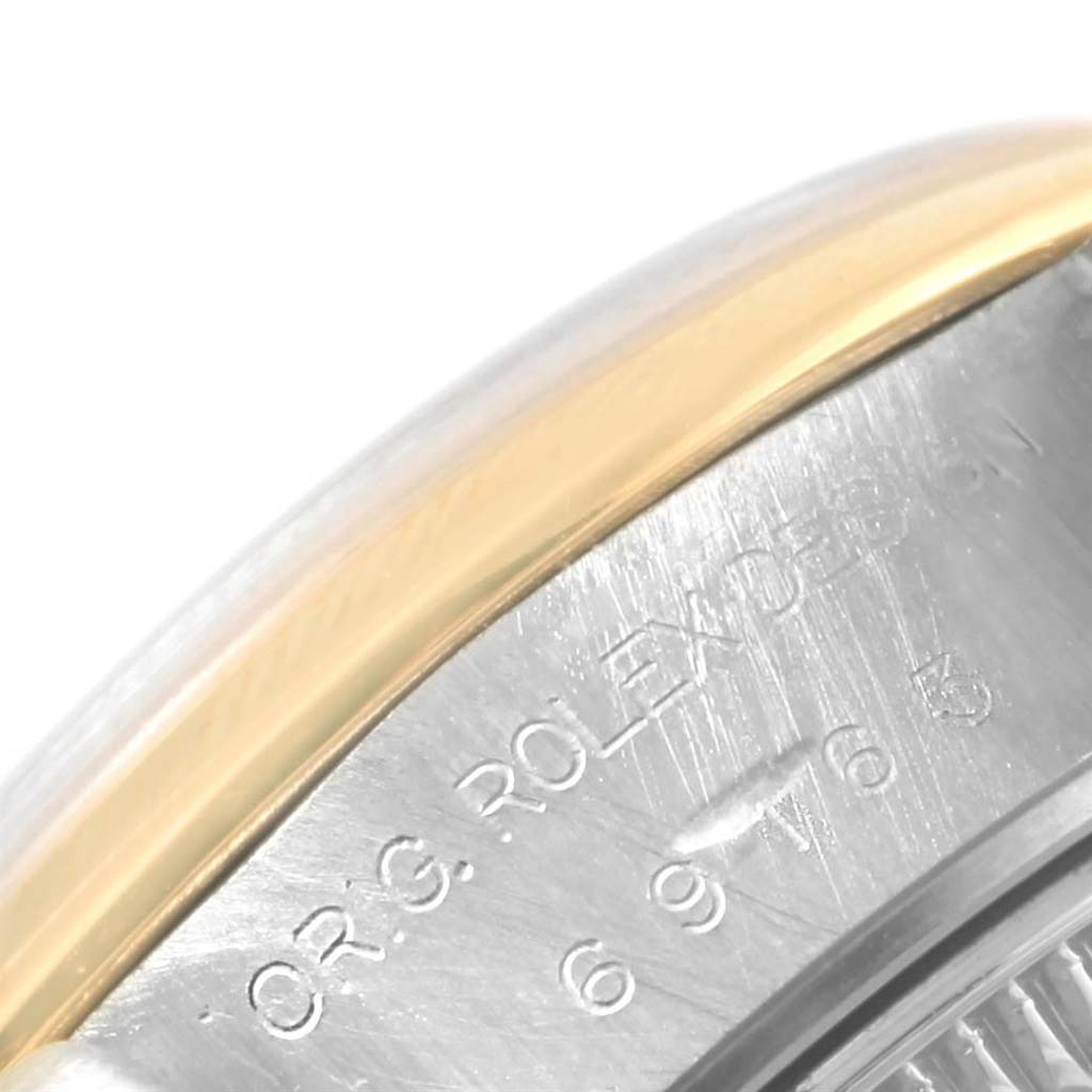 This close-up shows the side view of a Rolex Datejust 69163 Women's Stainless Steel Mother of Pearl Dial 69163 Women's Stainless Steel Mother of Pearl Dial watch, highlighting the bezel and case with engraved details.