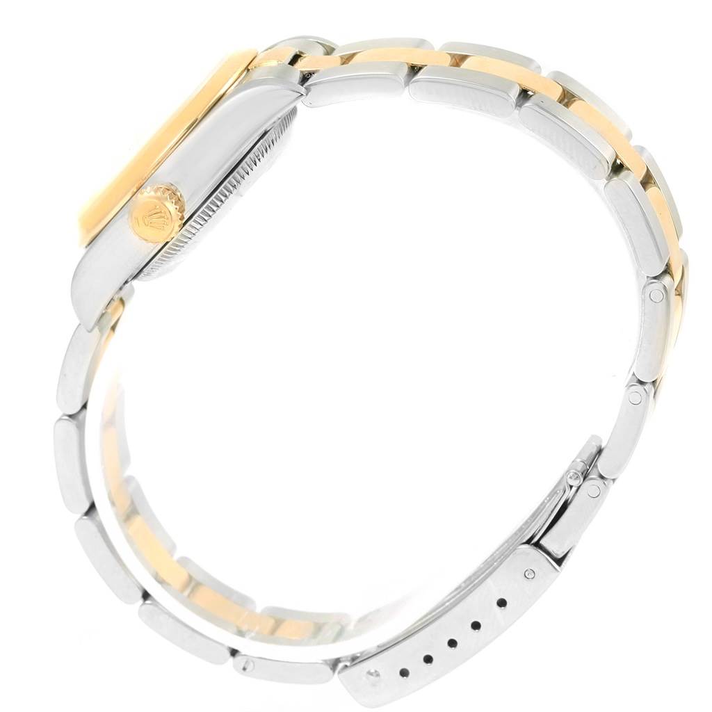 This side view of the Rolex Datejust 69163 Women's Stainless Steel Mother of Pearl Dial 69163 Women's Stainless Steel Mother of Pearl Dial watch showcases its crown, case, and bracelet.