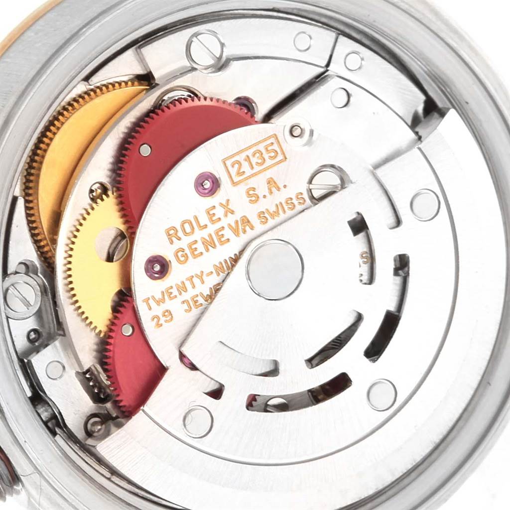 The image shows an internal close-up of the gears and movement of a Rolex Datejust 69173 Women's Stainless Steel Champagne Dial 69173 Women's Stainless Steel Champagne Dial watch.