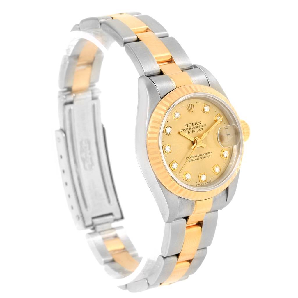 The image shows a side view of the Rolex Datejust 69173 Women's Stainless Steel Champagne Dial 69173 Women's Stainless Steel Champagne Dial watch, highlighting its gold and silver bracelet and diamond-studded dial.