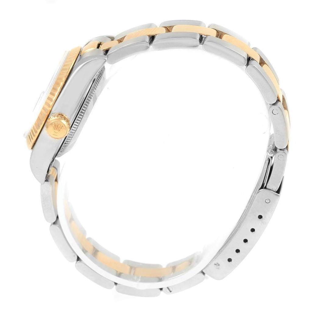 The Rolex Datejust 69173 Women's Stainless Steel Champagne Dial 69173 Women's Stainless Steel Champagne Dial model is shown from a side angle, highlighting its crown, bezel, and bracelet.