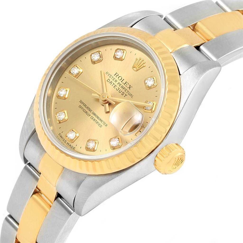 This image shows a side angle of a Rolex Datejust 69173 Women's Stainless Steel Champagne Dial 69173 Women's Stainless Steel Champagne Dial watch, highlighting its gold bezel, crown, dial, and two-tone bracelet.