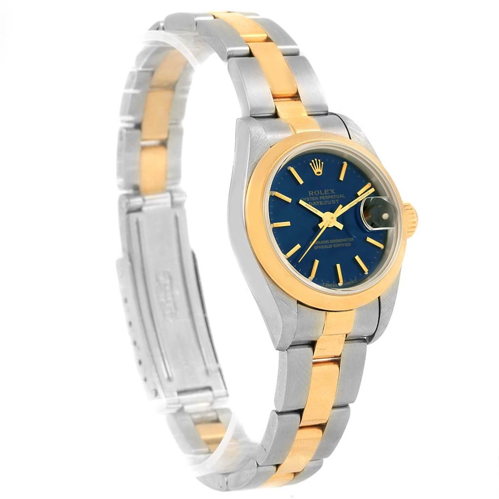 The image shows a Rolex Datejust 69163 Women's Stainless Steel Blue Dial 69163 Women's Stainless Steel Blue Dial watch at an angled view, highlighting the blue dial, two-tone metal bracelet, and gold bezel.