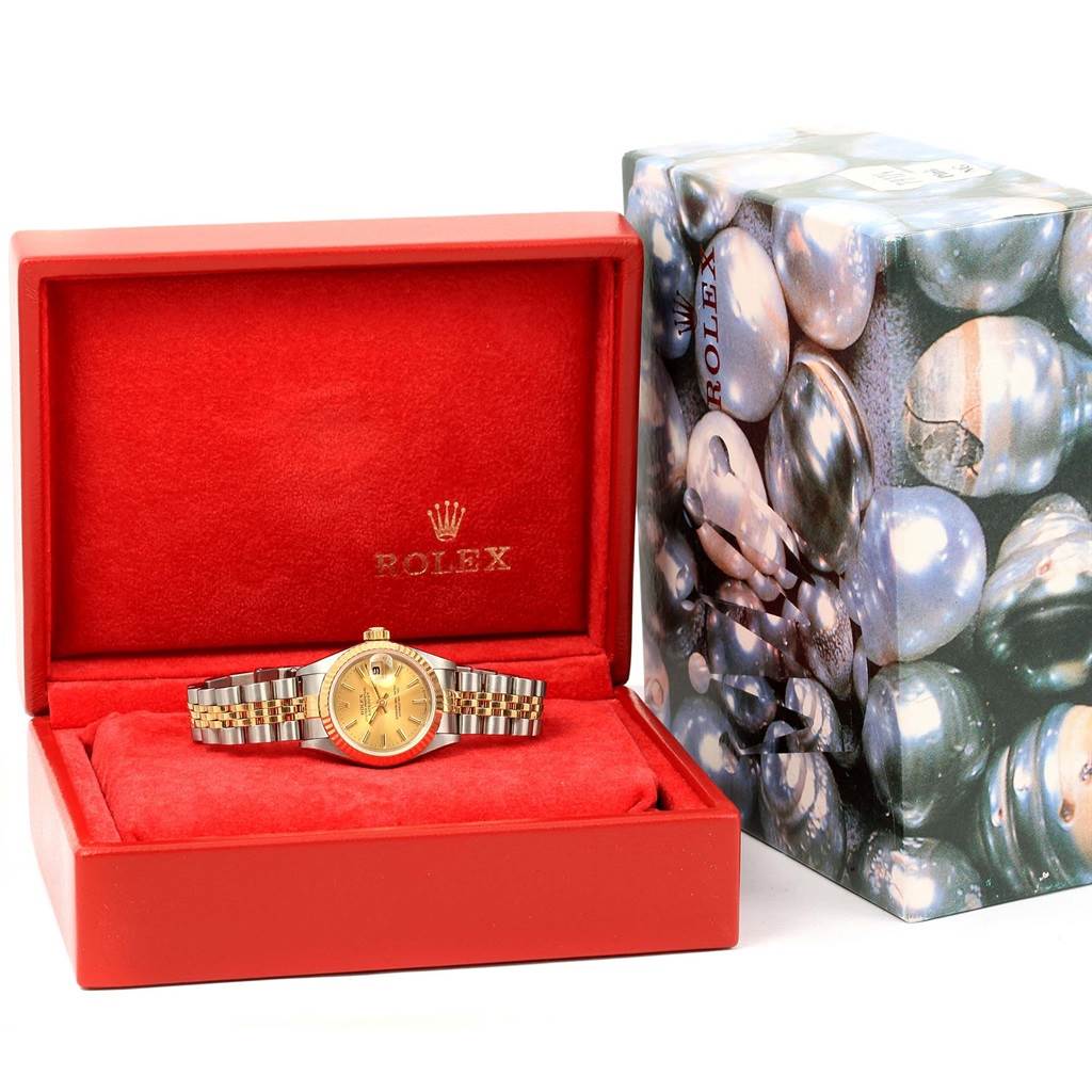 The image shows a Rolex Datejust 69173 Women's Stainless Steel Champagne Dial 69173 Women's Stainless Steel Champagne Dial watch in its open red box, positioned with the face and bracelet visible, alongside the watch's outer decorative box.