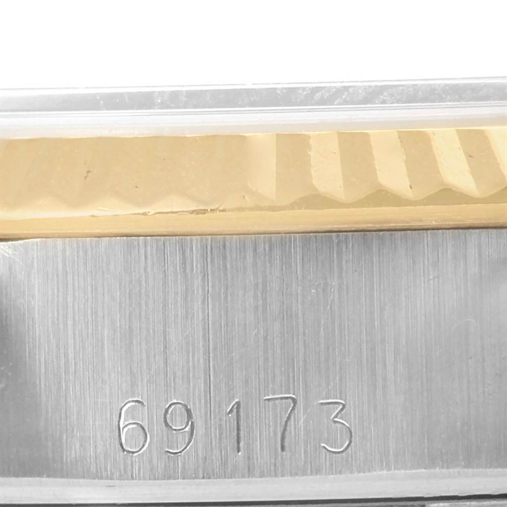 This close-up image shows the model number "69173" etched on the case of a Rolex Datejust 69173 Women's Stainless Steel Champagne Dial 69173 Women's Stainless Steel Champagne Dial watch.