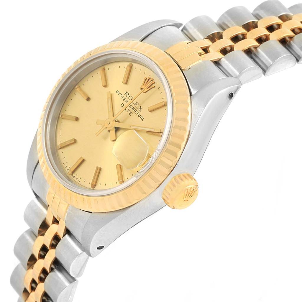 This image shows a side angle of a Rolex Datejust 69173 Women's Stainless Steel Champagne Dial 69173 Women's Stainless Steel Champagne Dial watch, featuring a two-tone bracelet and gold bezel with the crown visible.