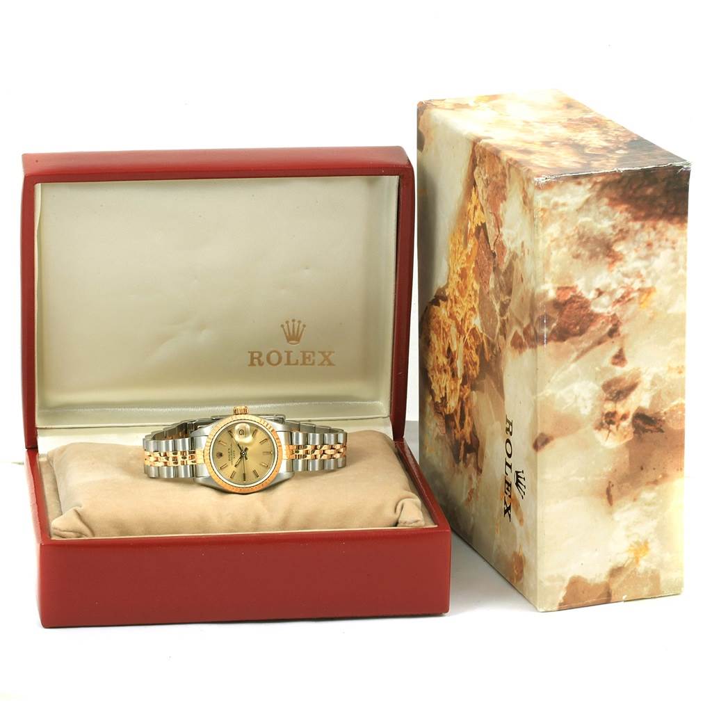 The Rolex Datejust 69173 Women's Stainless Steel Champagne Dial 69173 Women's Stainless Steel Champagne Dial watch is displayed in its open case with the outer box visible beside it.