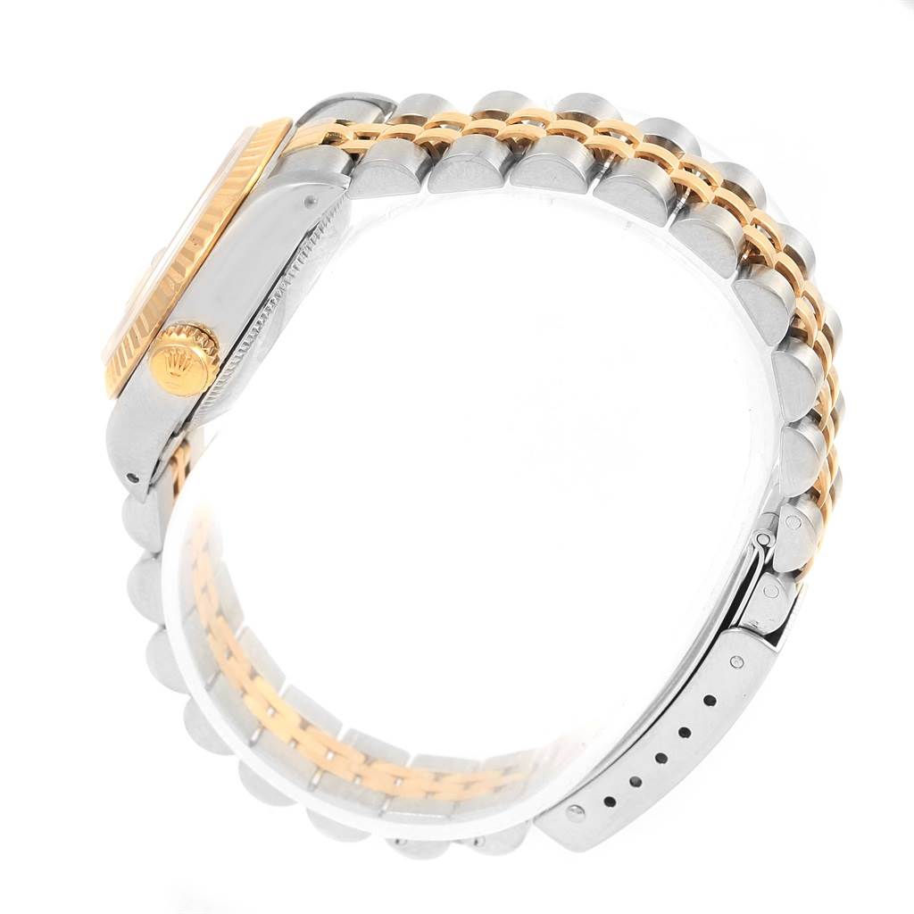 The image shows a side view of a Rolex Datejust 69173 Women's Stainless Steel Champagne Dial 69173 Women's Stainless Steel Champagne Dial watch, focusing on the crown, case, and two-tone bracelet.