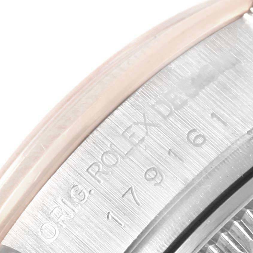 This close-up image shows the side engraving on the bezel of a Rolex Datejust 179161 Women's Steel and Gold (two tone) White Dial 179161 Women's Steel and Gold (two tone) White Dial watch.