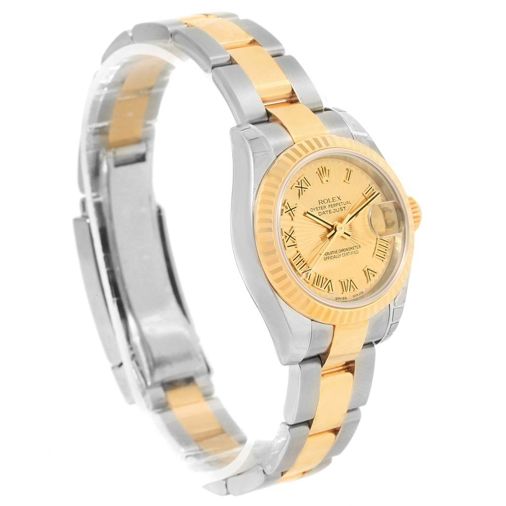 This image shows a side and part front view of a Rolex Datejust 179173 Women's Steel and Gold (two tone) Champagne Dial 179173 Women's Steel and Gold (two tone) Champagne Dial watch, highlighting its two-tone bracelet and dial.