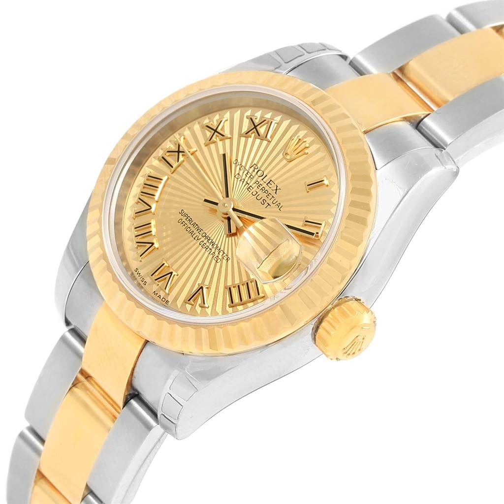 The image shows a close-up angle of a Rolex Datejust 179173 Women's Steel and Gold (two tone) Champagne Dial 179173 Women's Steel and Gold (two tone) Champagne Dial watch, highlighting its face, bezel, crown, and partially the bracelet.