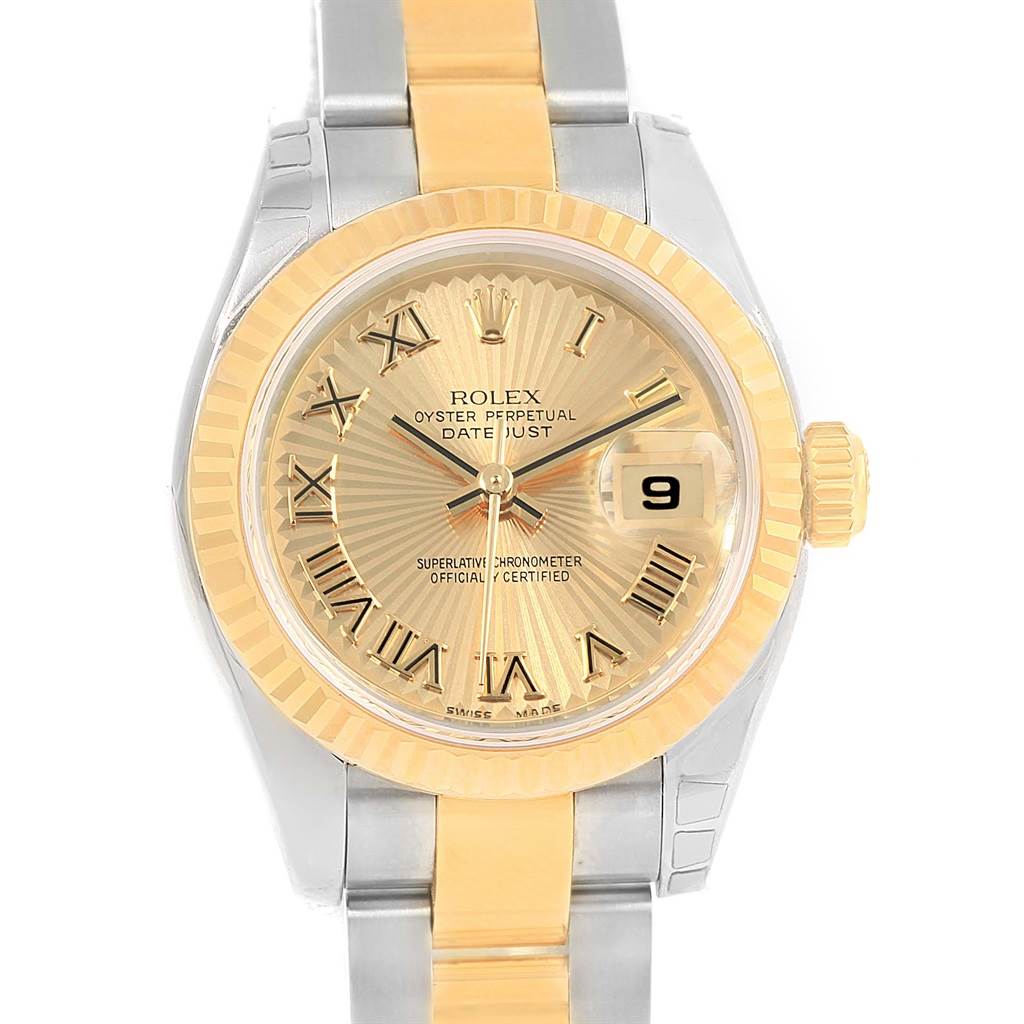 The image shows a front view of a Rolex Datejust 179173 Women's Steel and Gold (two tone) Champagne Dial 179173 Women's Steel and Gold (two tone) Champagne Dial watch with a gold and silver bracelet, gold dial, and date display.