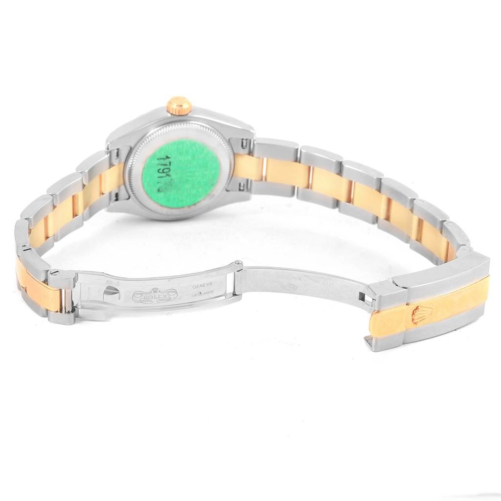 The image shows the back and bracelet of a Rolex Datejust 179173 Women's Steel and Gold (two tone) Champagne Dial 179173 Women's Steel and Gold (two tone) Champagne Dial watch with a two-tone metal strap and an open clasp.