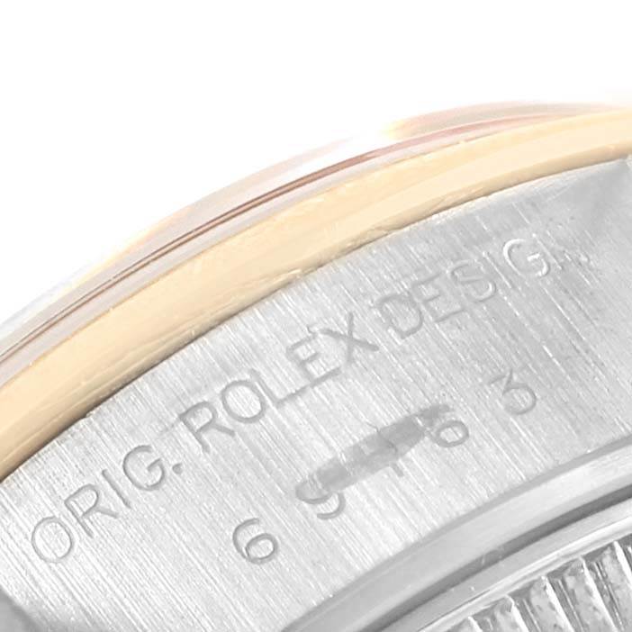 This close-up image shows the engraved details on the case of a Rolex Datejust 69163 Women's Stainless Steel Grey Dial 69163 Women's Stainless Steel Grey Dial watch.