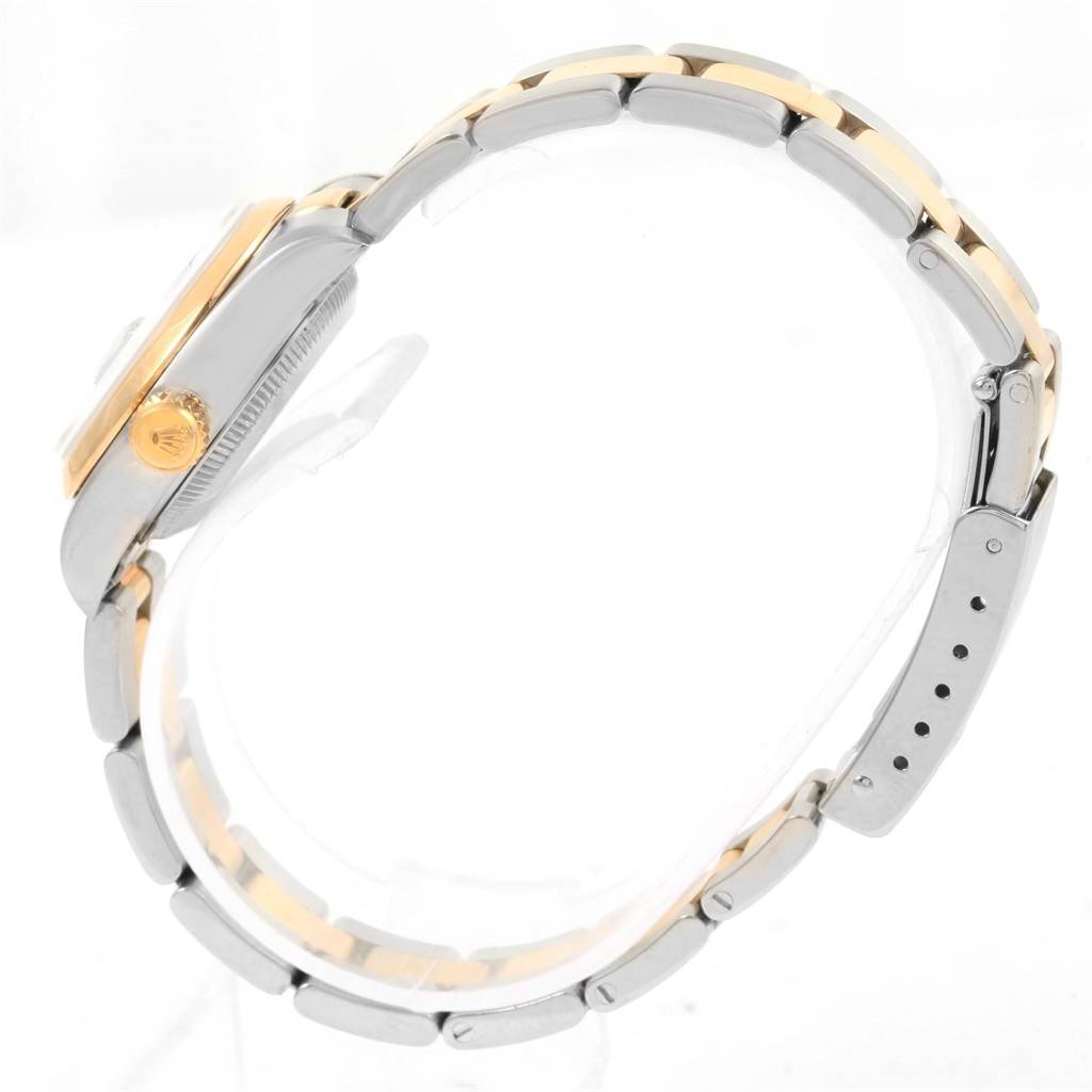 The Rolex Datejust 69163 Women's Stainless Steel Grey Dial 69163 Women's Stainless Steel Grey Dial watch is shown from a side profile, focusing on its crown, case, and bracelet.