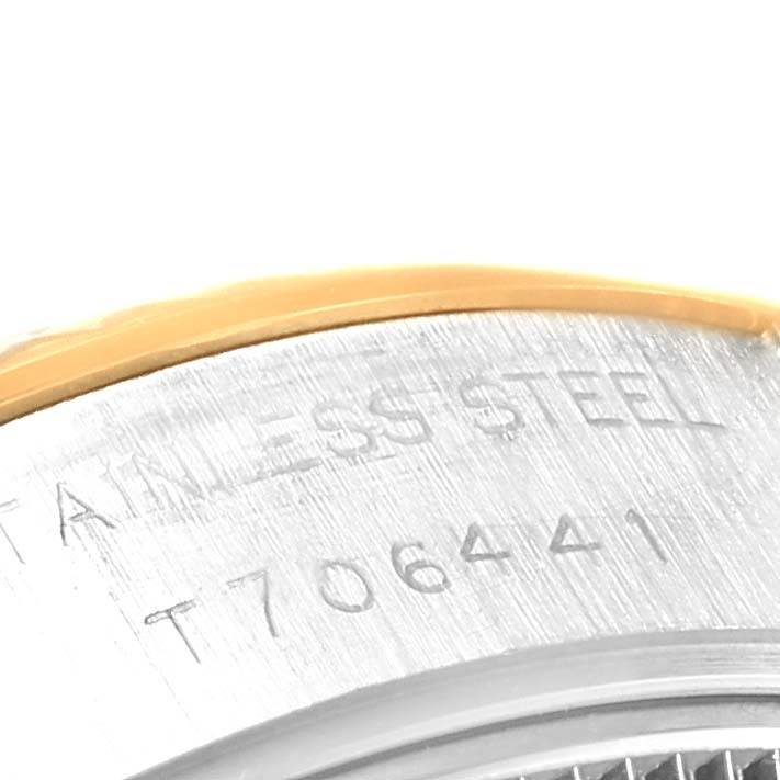 This close-up image shows a portion of the case back of a Rolex Datejust 69173 Women's Stainless Steel Champagne Dial 69173 Women's Stainless Steel Champagne Dial watch with the "STAINLESS STEEL" inscription.
