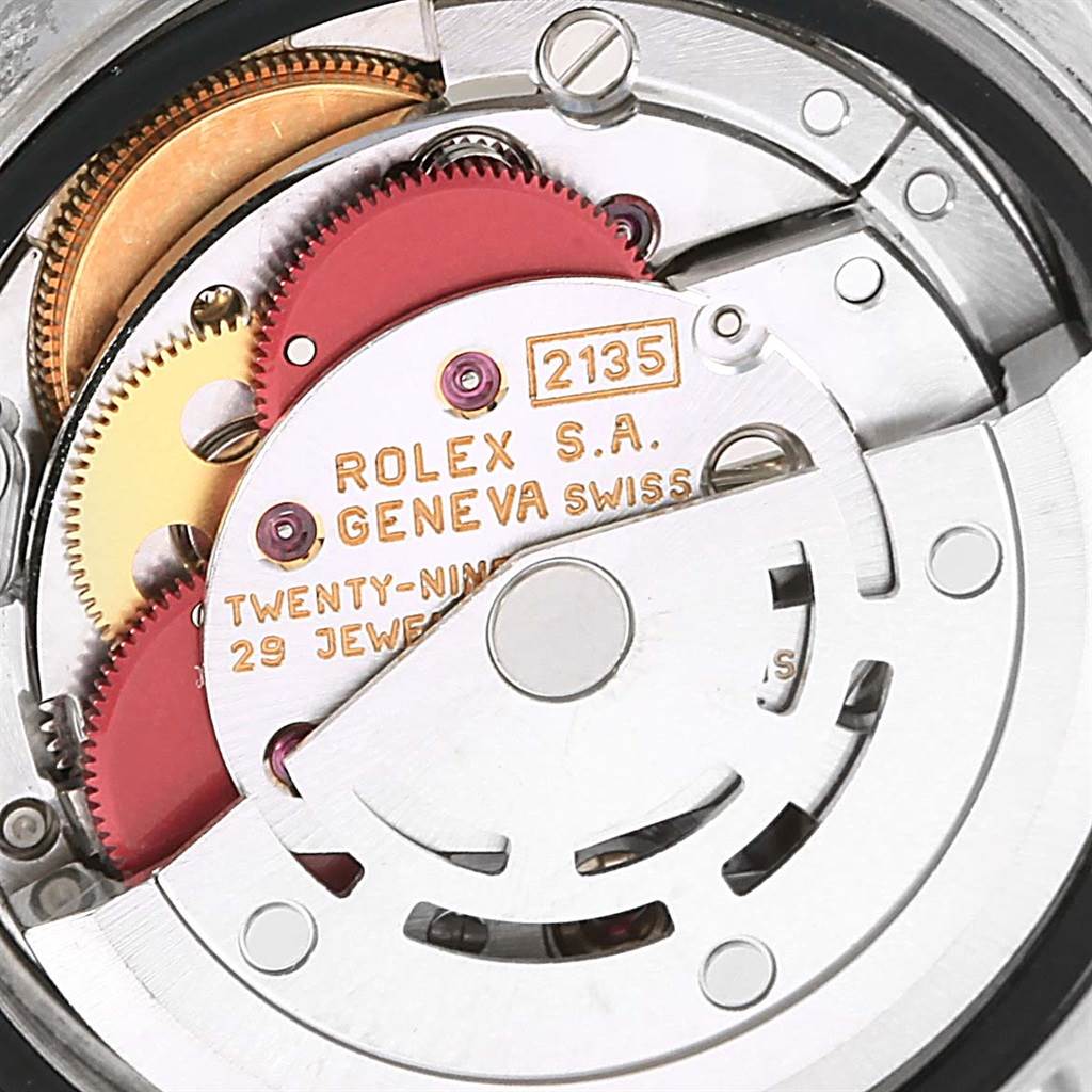 This image shows the internal movement mechanism of a Rolex Datejust 69173 Women's Stainless Steel Champagne Dial 69173 Women's Stainless Steel Champagne Dial watch, highlighting gears and intricate components.