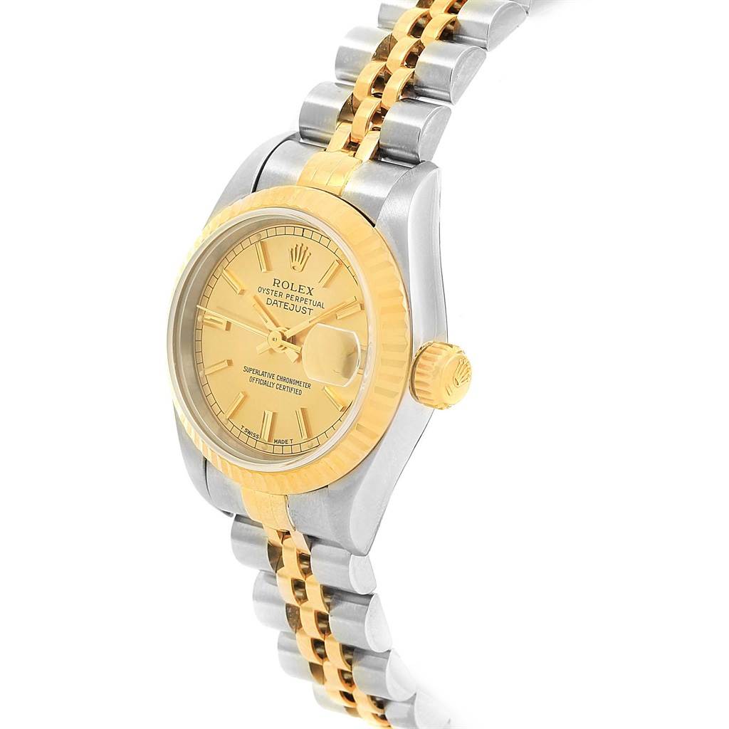 This image shows a Rolex Datejust 69173 Women's Stainless Steel Champagne Dial 69173 Women's Stainless Steel Champagne Dial watch at an angular side view, highlighting its champagne dial, fluted bezel, and Jubilee bracelet.