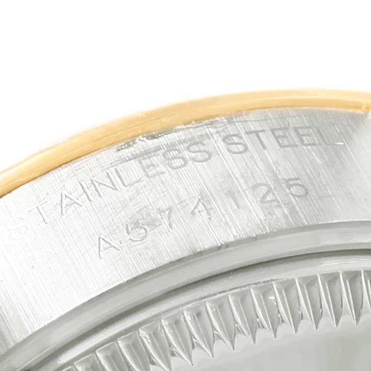 The image shows a close-up of the stainless steel rim and fluted bezel of a Rolex Datejust 79173 Women's Steel and Gold (two tone) Silver Dial 79173 Women's Steel and Gold (two tone) Silver Dial watch.