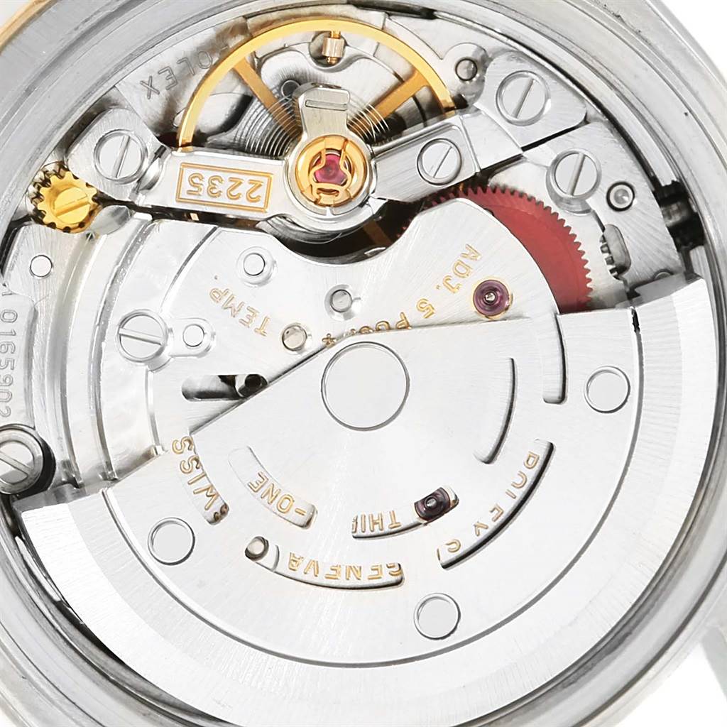 This close-up image shows the intricate internal mechanism of a Rolex Datejust 79173 Women's Steel and Gold (two tone) Silver Dial 79173 Women's Steel and Gold (two tone) Silver Dial watch.
