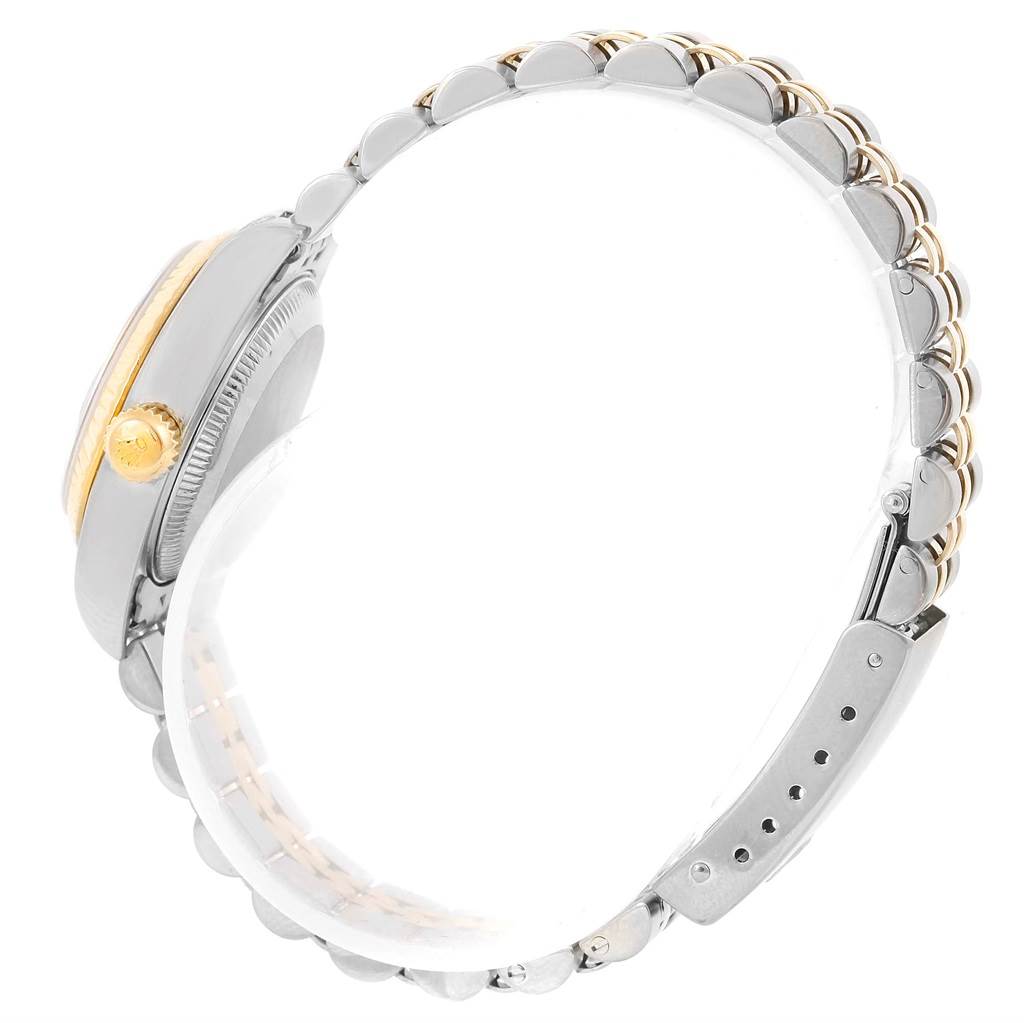 The image shows a side profile of a Rolex Datejust 79173 Women's Steel and Gold (two tone) Silver Dial 79173 Women's Steel and Gold (two tone) Silver Dial watch, highlighting the watch case, crown, and two-tone bracelet.