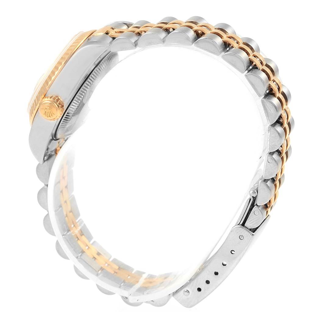 The image shows a side view of a Rolex Datejust 79173 Women's Steel and Gold (two tone) Champagne Dial 79173 Women's Steel and Gold (two tone) Champagne Dial watch highlighting its two-tone bracelet and crown.