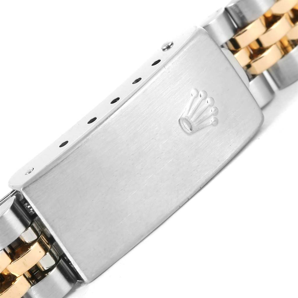 The image shows a close-up of the clasp and part of the bracelet of a Rolex Datejust 79173 Women's Steel and Gold (two tone) Champagne Dial 79173 Women's Steel and Gold (two tone) Champagne Dial watch.