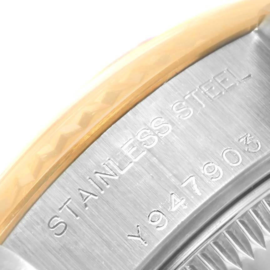 The image shows a close-up of the case back edge and serial number of a Rolex Datejust 79173 Women's Steel and Gold (two tone) Champagne Dial 79173 Women's Steel and Gold (two tone) Champagne Dial watch, highlighting the stainless steel material.