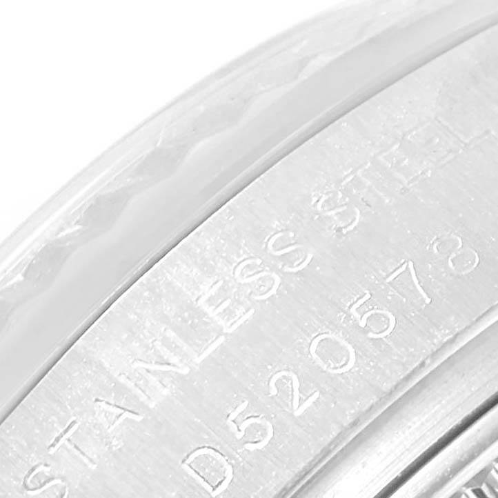 This close-up image shows the edge of the case and engraved serial number on a Rolex Datejust 179174 Women
s Stainless Steel Mother of Pearl Dial 179174 Women
s Stainless Steel Mother of Pearl Dial watch.