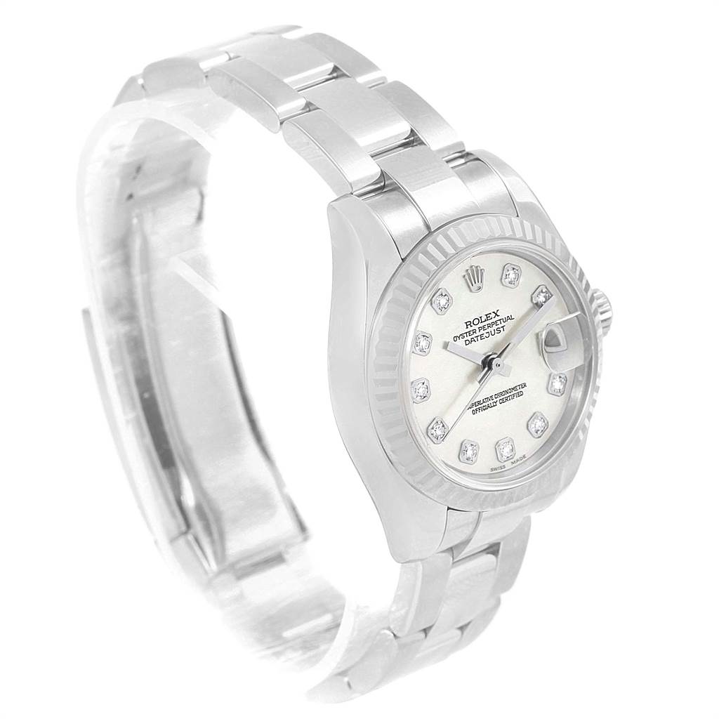 The image shows a Rolex Datejust 179174 Women
s Stainless Steel Mother of Pearl Dial 179174 Women
s Stainless Steel Mother of Pearl Dial watch from a front left angle, highlighting its dial, bezel, and bracelet.