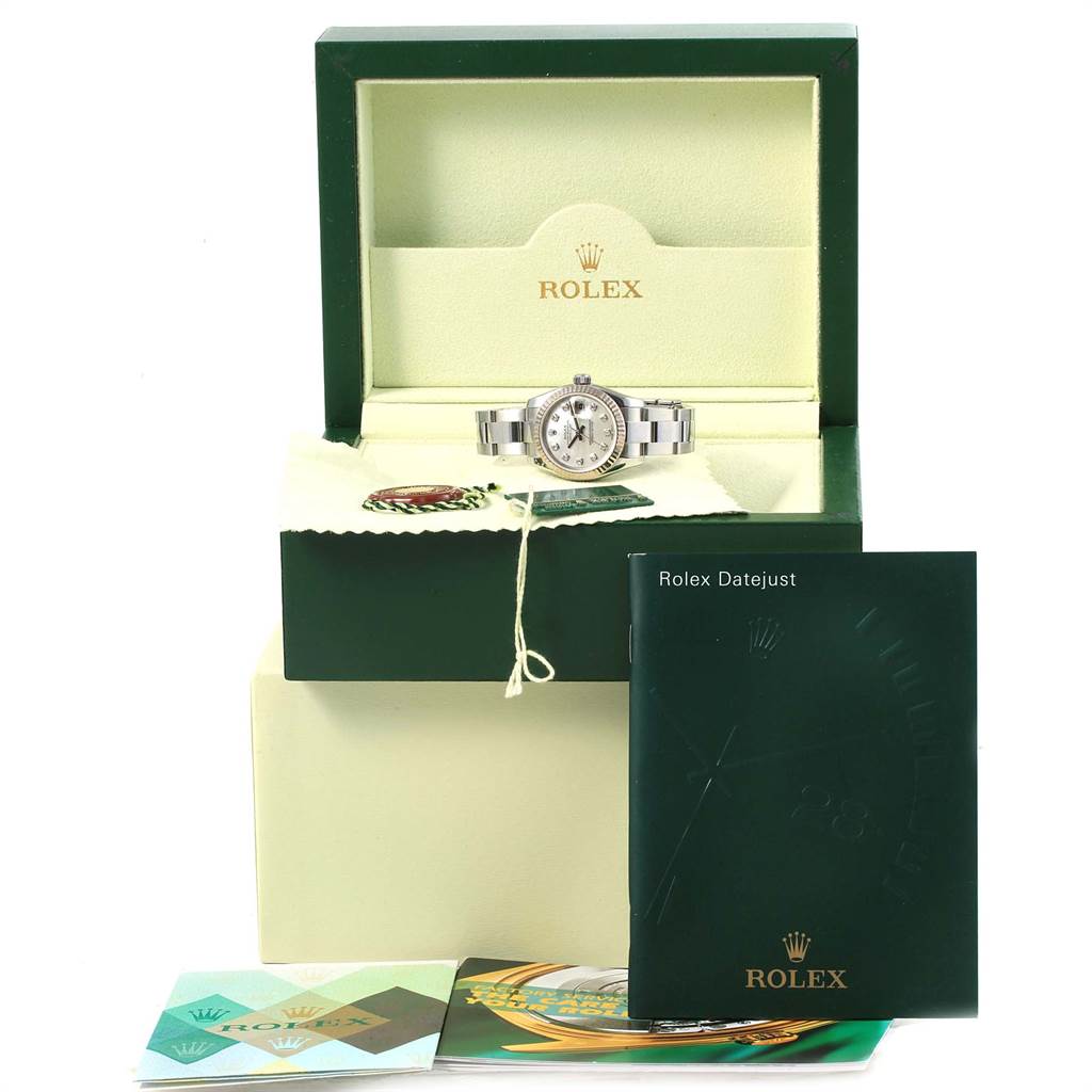 The image shows a Rolex Datejust 179174 Women
s Stainless Steel Mother of Pearl Dial 179174 Women
s Stainless Steel Mother of Pearl Dial watch in its open display box with accompanying manuals and tags.